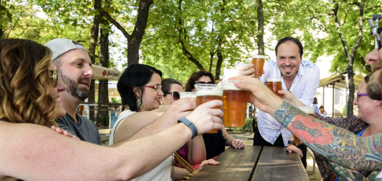 friends-cheering-with-bottles-beers