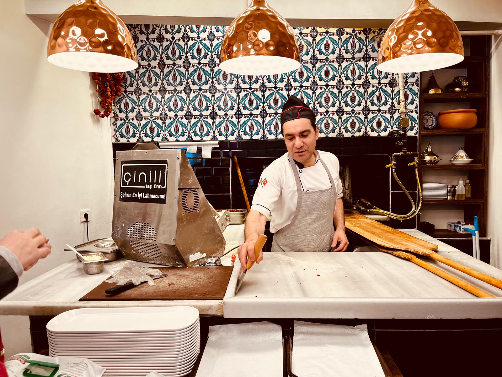 Turkish chef preparing a traditional dish in an Istanbul restaurant